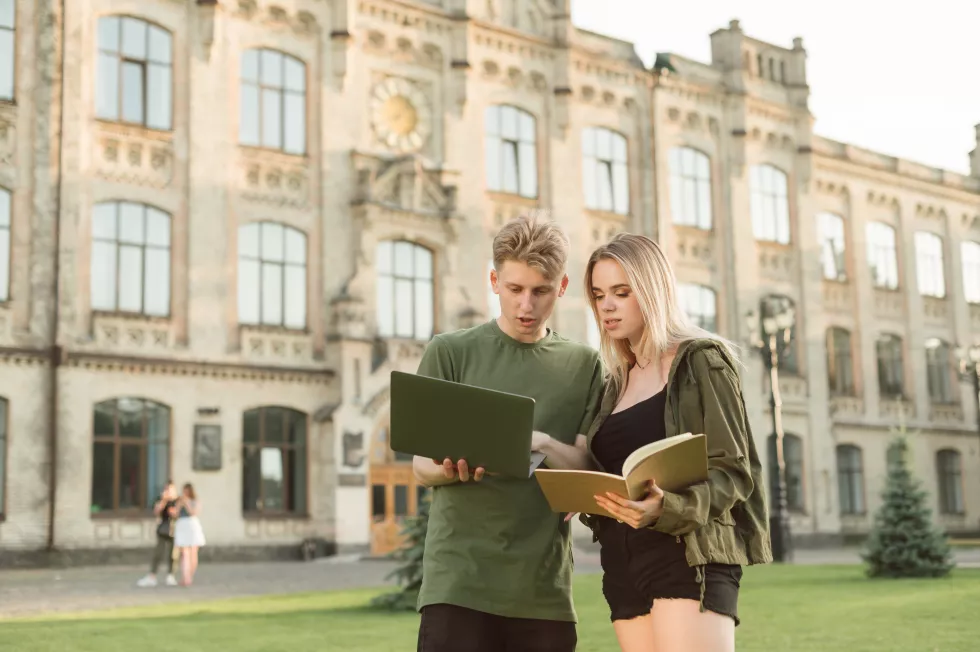 couple-students-standing-near-college