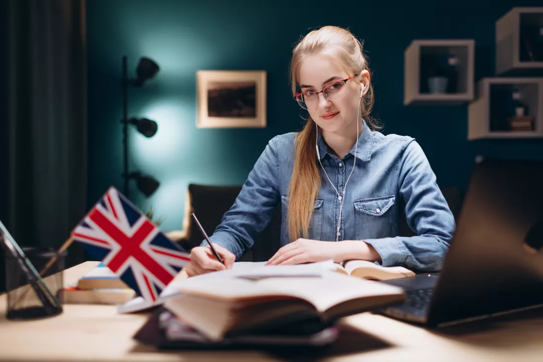 young-student-learning-english-living-room-desk