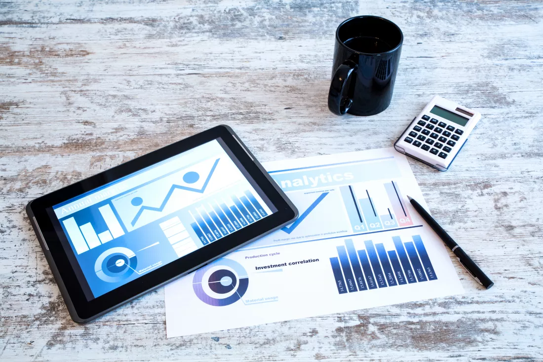 business-analytics-wooden-desk-with-tablet-pc