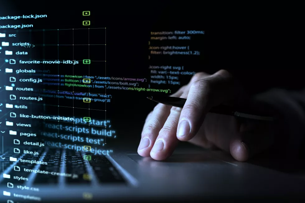 programming-background-with-person-working-with-codes-computer